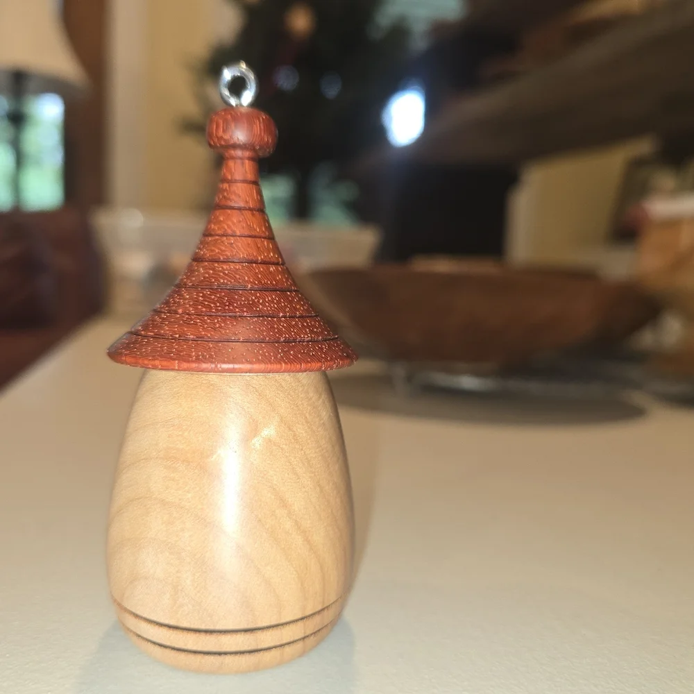 Charming Wooden Birdhouse with Red Bird Accent